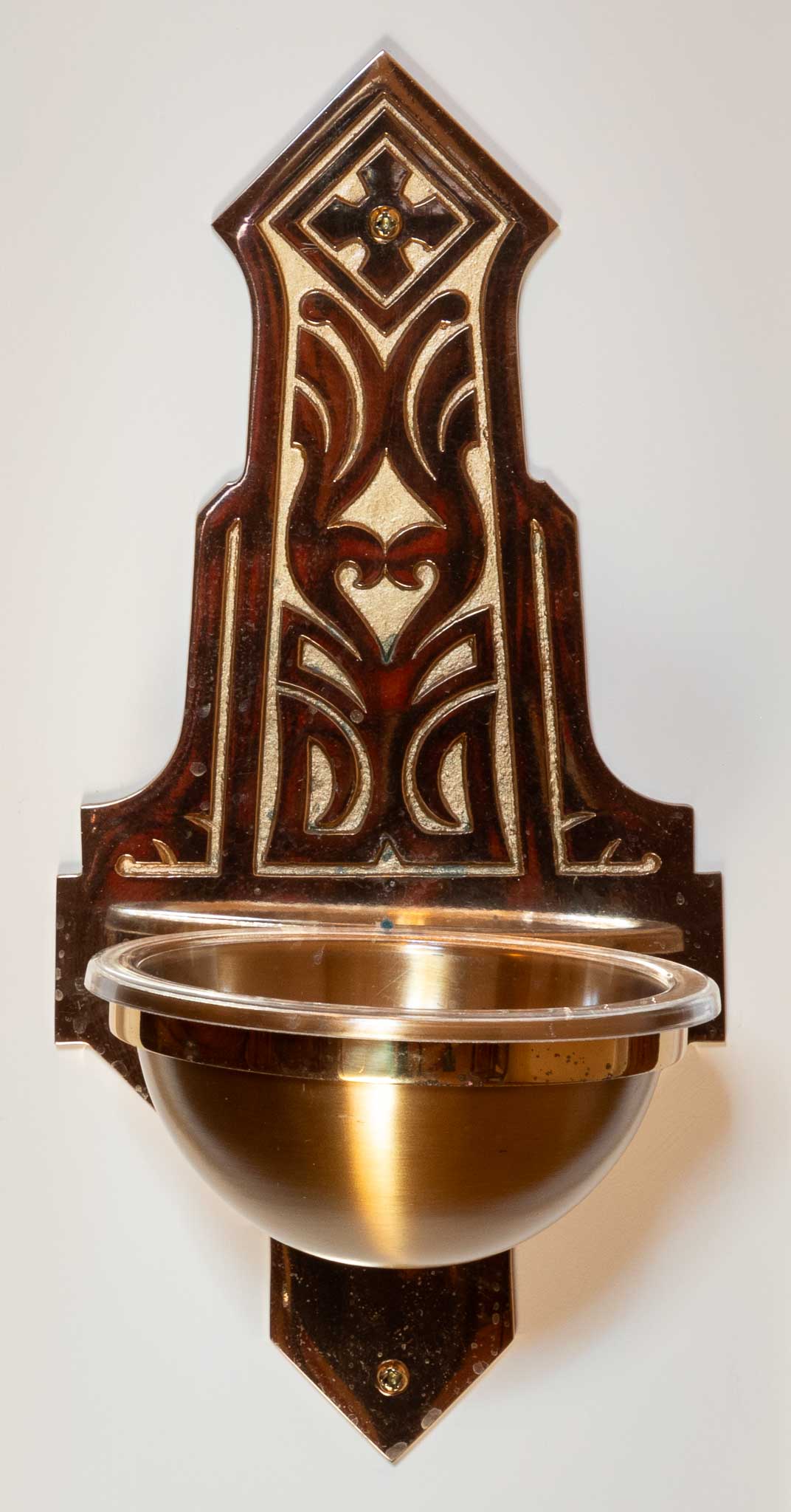 A small baptismal font at the entrance of the church