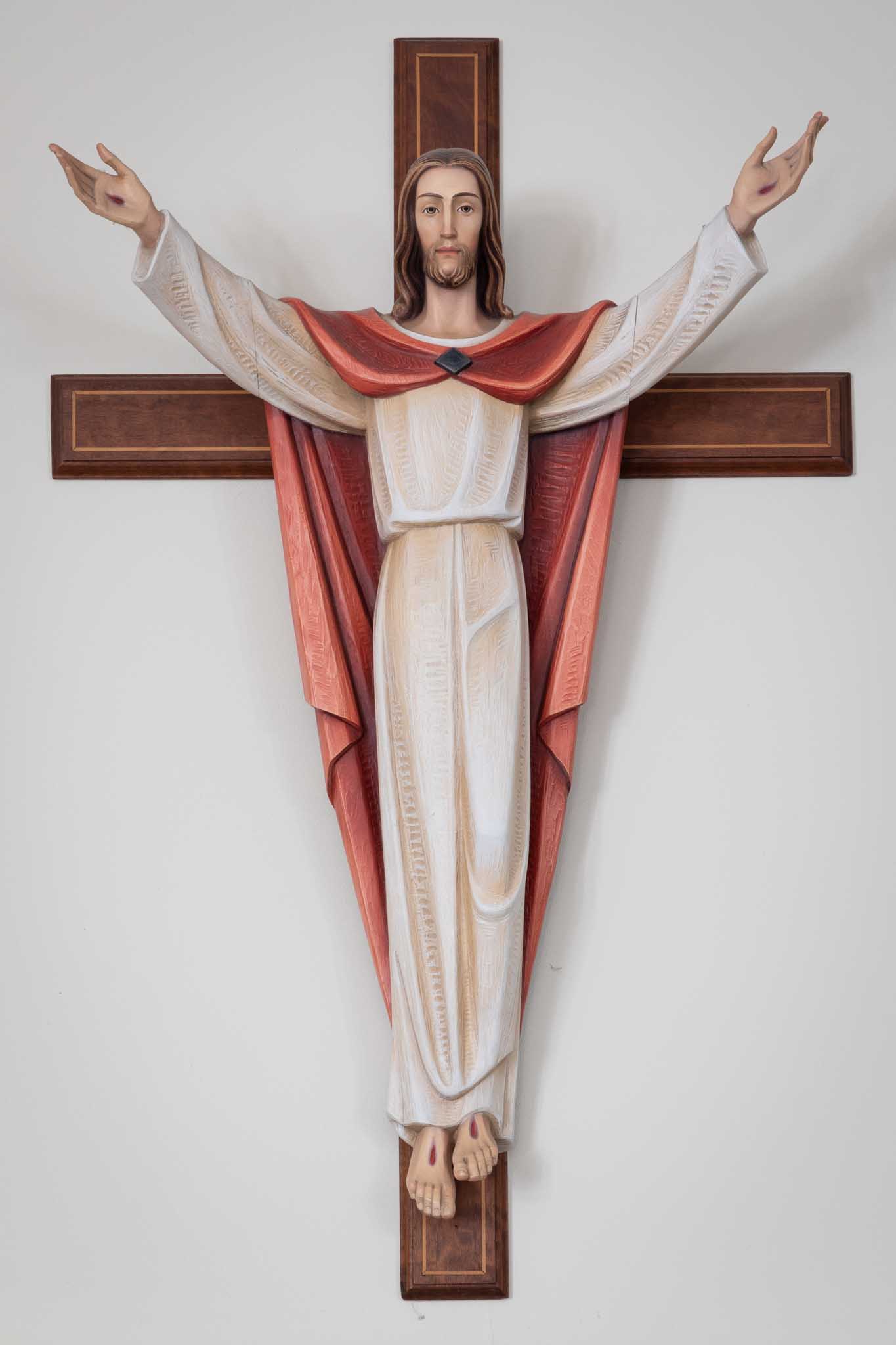 Jesus on the cross with arms stretched out.